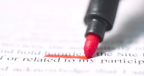 Macro view of red marker highlighting text on document for education, office Stock Footage 293074715