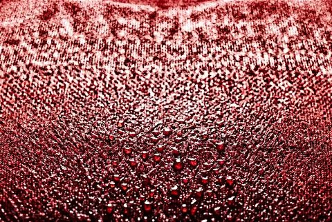 Macro view of red wet textured fabric surface Illustrazione stock