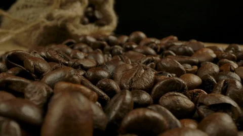 Macro view of roasted coffee beans and jute sack Stock Footage 127829715