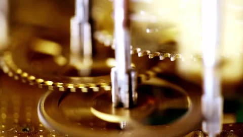 Macro view of rotating brass clockwork gears in motion detail. Stock Footage 342419678