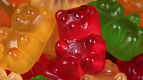 Macro view with rotation of colorful gummy bear shaped candies.candy background Stock Footage 170620133