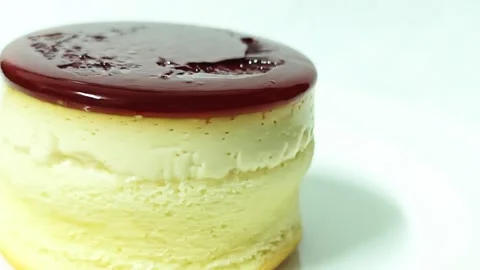 Macro view of a round caramel custard pudding cake with copy space. Stock Footage 345339549