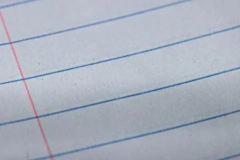 Macro View of Ruled Notebook Paper with Red Margin Line Photos