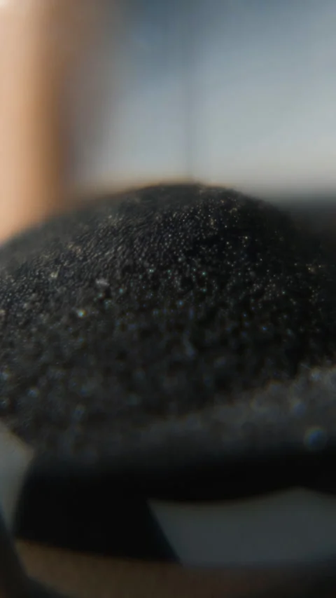 Macro view of sand falling in hourglass Stock Footage 322218631