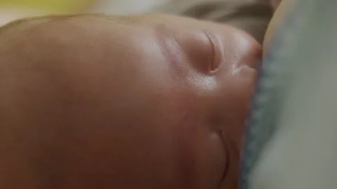A macro view showcasing the delicate and soft skin of a newborn baby 스톡 동영상 336533415