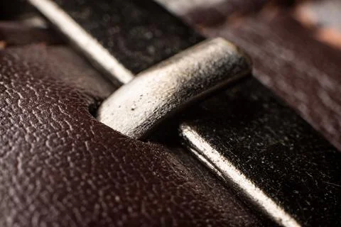 Macro view showcasing textured brown leather and metallic buckle in a creative Stock Photos