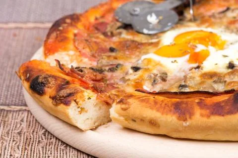 Macro view slice of pizza with ham and egg Stock Photos