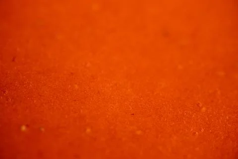 Macro view of smooth orange-red strawberry puree. Stock Photos