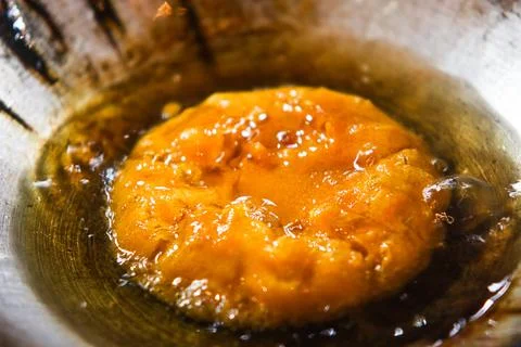 Macro View of Soft Center Kue Cucur Batter Frying in Hot Cooking Oil Wok Stock Photos