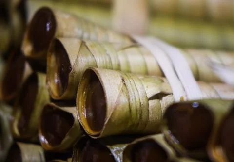 Macro View of Soft Palm Sugar Rice Cake Kue Celorot in Coconut Leaf Cones Stock Photos