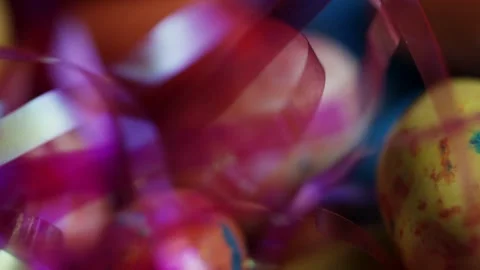 Macro view of speckled jelly beans and pink tinsel Stock Footage 328084405