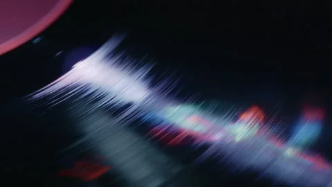Macro View of Spinning Vinyl Record Under Purple Lighting Stock Footage 345399262