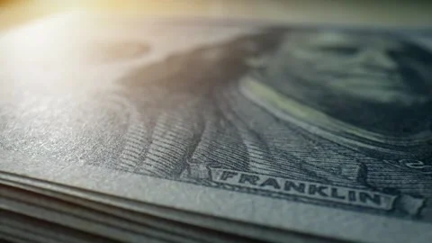 A macro view of a stack of American 100 dollar bills. 4K. Stock Footage 263699519