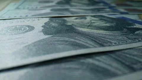 A macro view of a stack of American 100 dollar bills. 4K. Stock Footage 263699598
