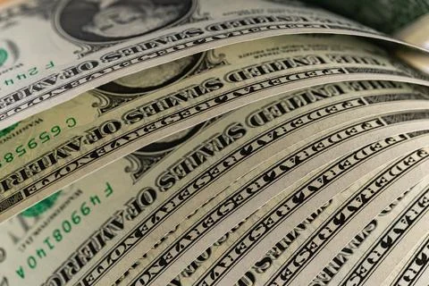 Macro View of Stacked One US Dollar Bills with Focus on George Washington P.. Stock Photos