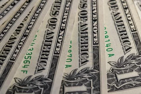 Macro View of Stacked One US Dollar Bills with Focus on George Washington P.. Stock Photos