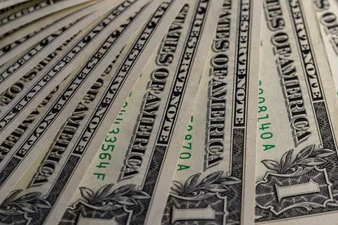 Macro View of Stacked One US Dollar Bills with Focus on George Washington P.. Stock Photos
