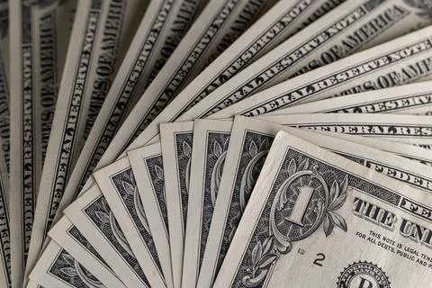 Macro View of Stacked One US Dollar Bills with Focus on George Washington P.. Stock Photos