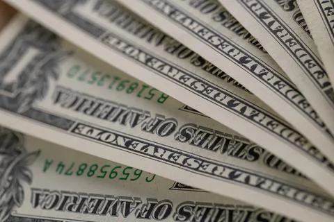 Macro View of Stacked One US Dollar Bills with Focus on George Washington P.. Stock Photos