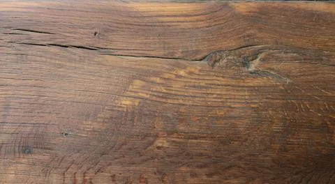 Macro view of stained wood with a deep crack Stock Photos