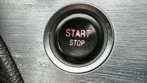 Macro view of start and stop engine button close-up. Control panel inside Stock Photos