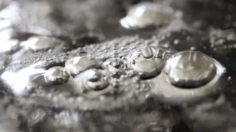 Macro view of the sticky and thick boiling liquid surface, rising bubbles Stock Footage 141043763