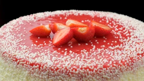 Macro view of strawberry cheesecake decorated with fresh berries on black backgr Stock Footage 342720366