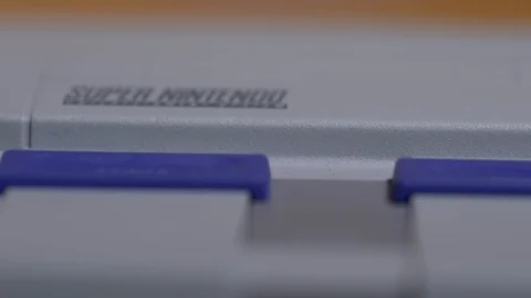 Macro View Of Super Nintendo Console And Controller. Stock Footage 129972915