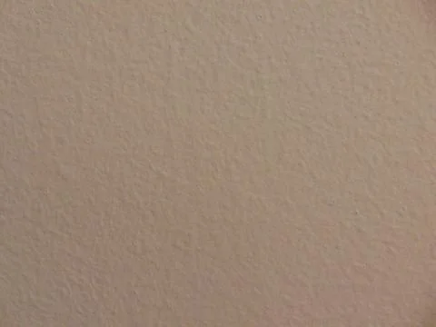 Macro view of the surface of the surface of a white wall Stock Photos