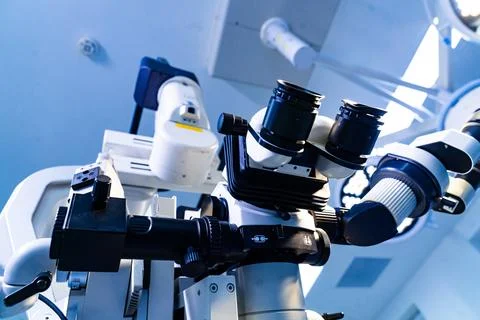 Macro view of surgical microscope eyepieces and adjustment knobs Stock Photos