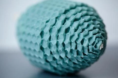 Macro View of a Teal Beeswax Egg Candle with Honeycomb Texture and Shallow .. Stock Photos
