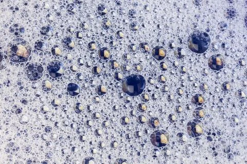 Macro view of tightly packed soap bubbles showing detailed surface tension .. Stock Photos