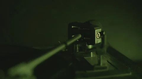 Macro view of turntable stylus and vinyl with shifting neon lights, perfect.. Video stock 310723703