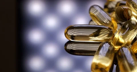 Macro view: Vitamins supplements pills omega 3. Fish oil capsules. 4k. 50fps Stockbeeldmateriaal 108102034