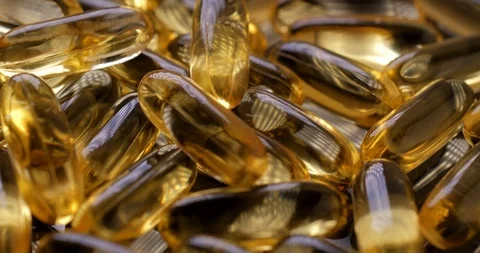 Macro view: Vitamins supplements pills omega 3. Fish oil capsules. 4k. 50fps Stockbeeldmateriaal 108102915
