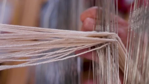 Macro View of Warp Threads During Traditional Weaving Stock Footage 337959795
