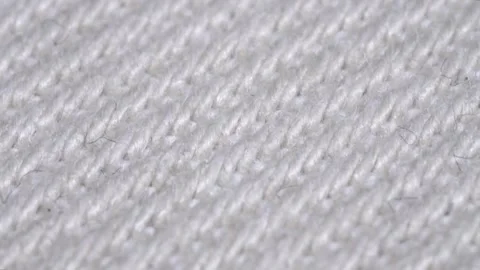Macro view of white knitted wool fabric texture s. Stock Footage 336332070