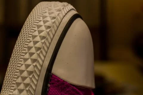 Macro view of the white rubber tip of the sports shoe. Stock Photos