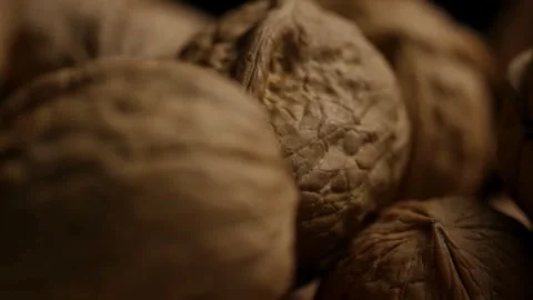 Macro view of whole walnuts with hard brown shells Stock Footage 327829485