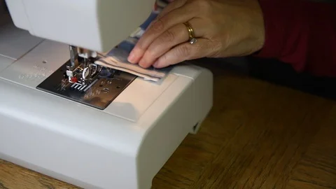 Macro view of a woman sewing with a machine Stock Footage 101436642