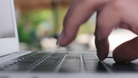 Macro view of woman's hands typing on a laptop computer outdoors Stock-Footage 75163878