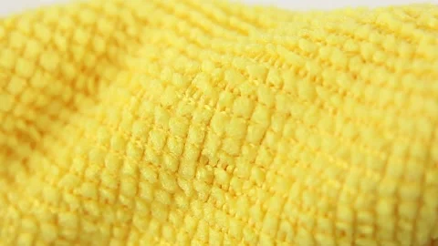 Macro view of yellow microfiber cloth, texture water absorbing synthetic fabric Видео 160053327