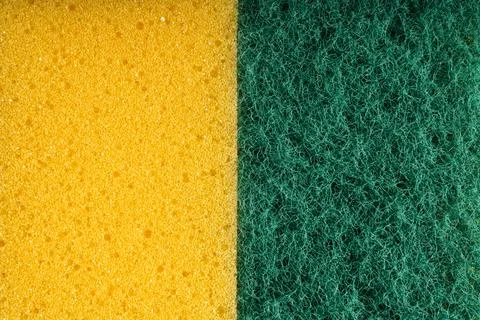 Macro View of Yellow Sponge and Green Scrubber Pad Foto stock