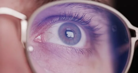 Macro View Of Young Man'S Eyes Glasses Online Shopping Watching Web Content Fake Stock Footage 172139645