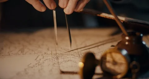 Macro vintage 1850 mapmaker using a compass on a map Stock Footage 101927713