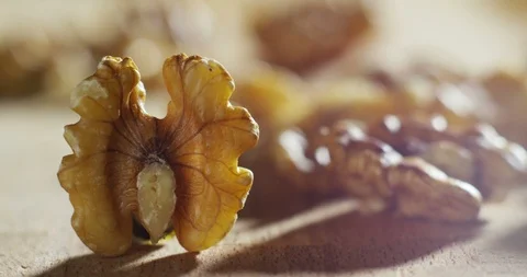 Macro of wallnuts on wooden table in professional restaurant kitchen Stock Footage 115308600