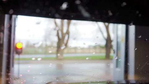 Macro water drops close-up on a front car window. Raining on a glass Stock Footage 123211619