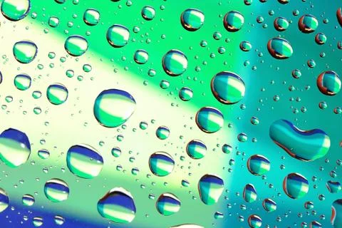 Macro of water drops on colored background Foto stock