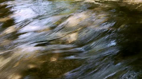 Macro of water running in a river Stock Footage