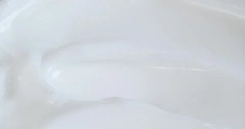 Macro white smooth eye, skin cream texture, closeup beauty facial cosmetics mask Stock Footage 241978220